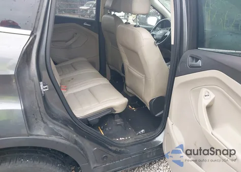 2017 Ford Escape Titanium z USA, uszkodzony, nr VIN 1FMCU0J99HUA84382